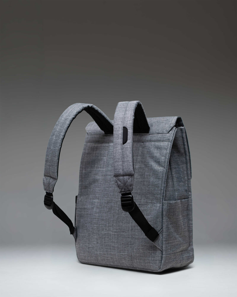 Herschel Supply Co. City Backpack in Raven Crosshatch grey, featuring a slim design with a single magnetic strap closure and clean aesthetic.