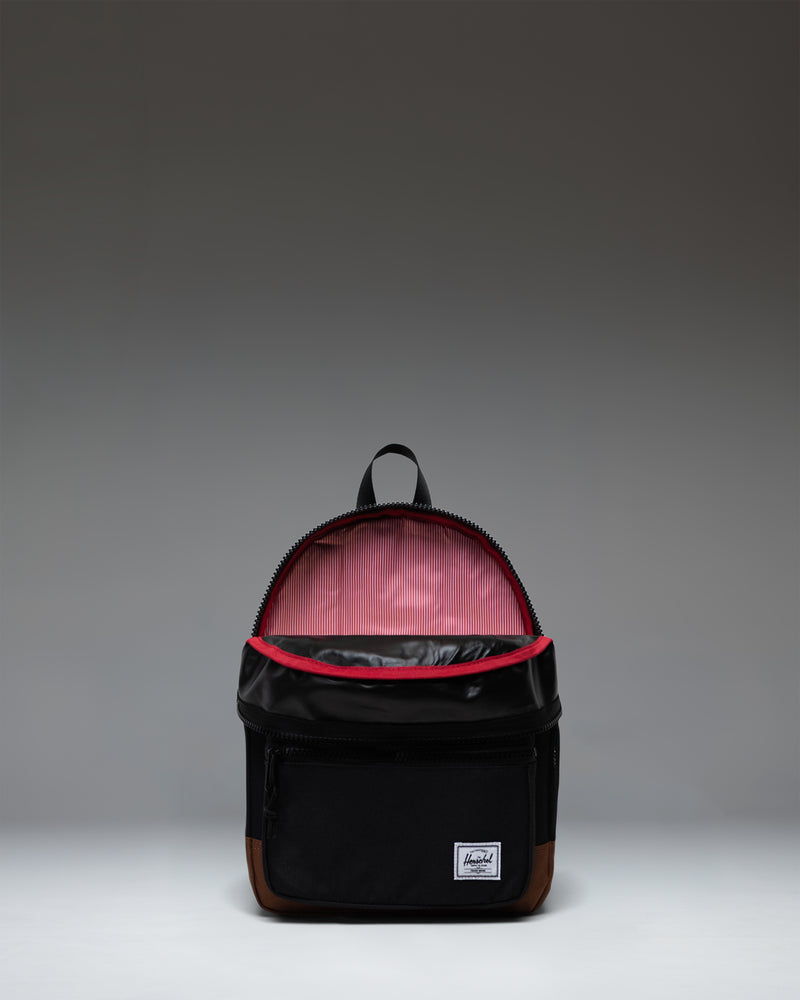 Herschel Heritage Kids Backpack in Black/Saddle Brown featuring a front pocket and signature diamond detail.