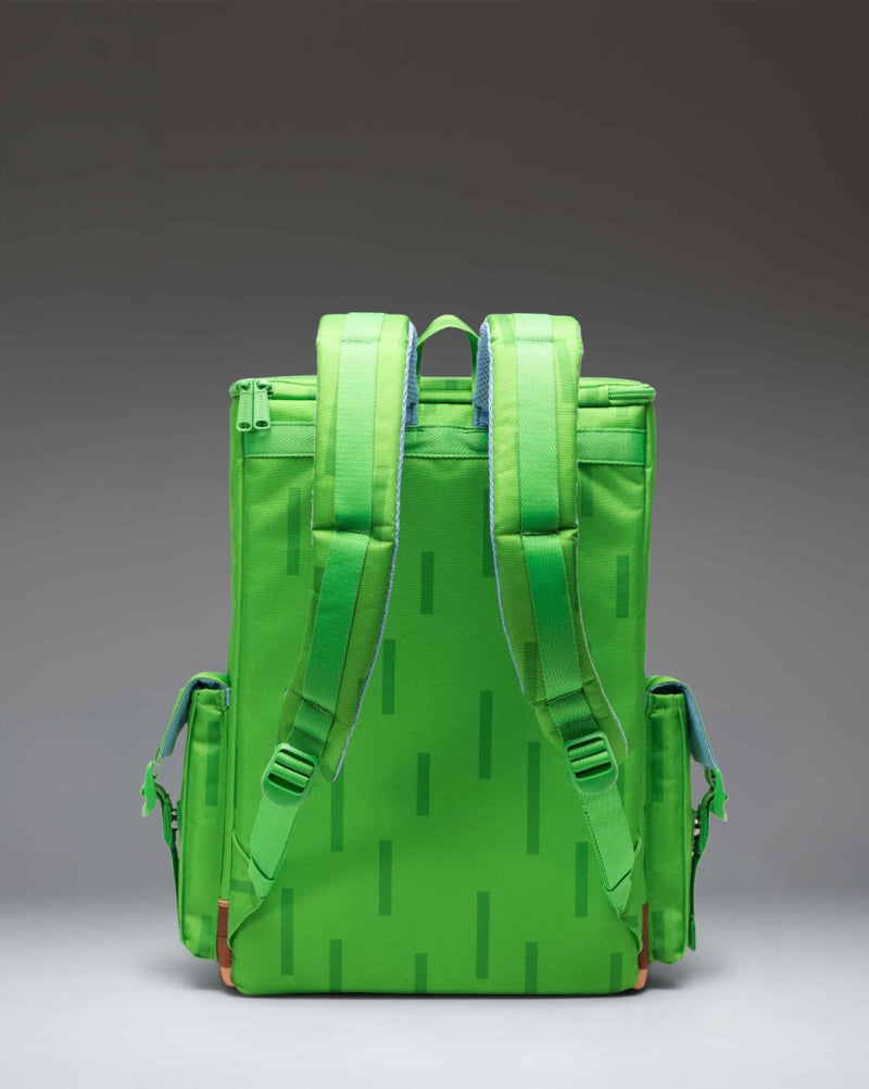 Herschel Supply Co. Minecraft Little America Cube Backpack in Grass Block green and brown pixelated pattern.
