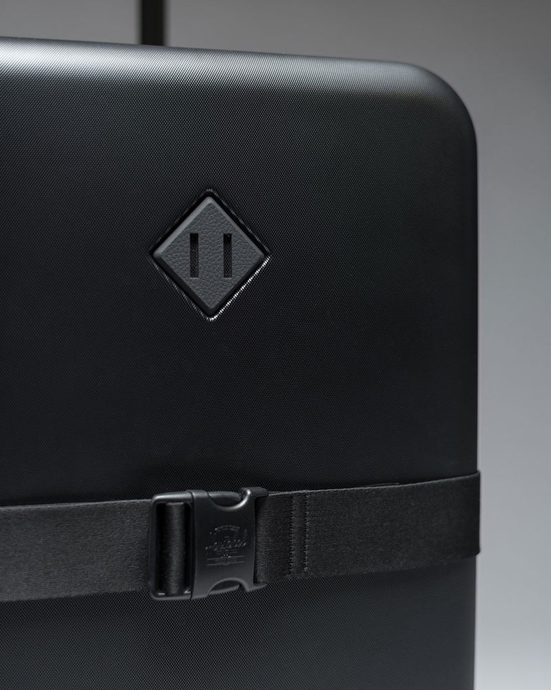 Herschel Heritage Hardshell Large Luggage Exp displayed in a variety of available colors.