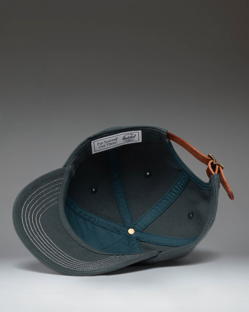 Herschel Sylas Premium Cap in Green Gables with vintage white contrast stitching, unstructured low crown, and curved brim.