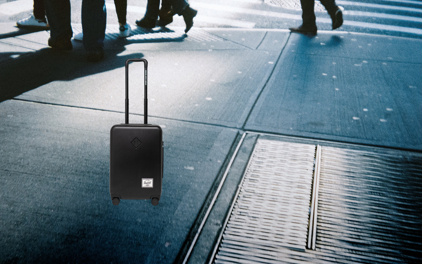 Herschel Heritage Hardshell Large Carry-On Luggage in black.