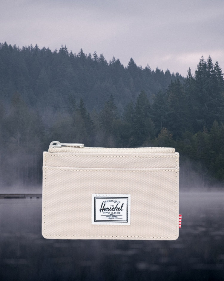 Herschel Supply Co. Oscar Cardholder in Eucalyptus, a compact wallet with multiple card slots and a sleek, minimalist design.